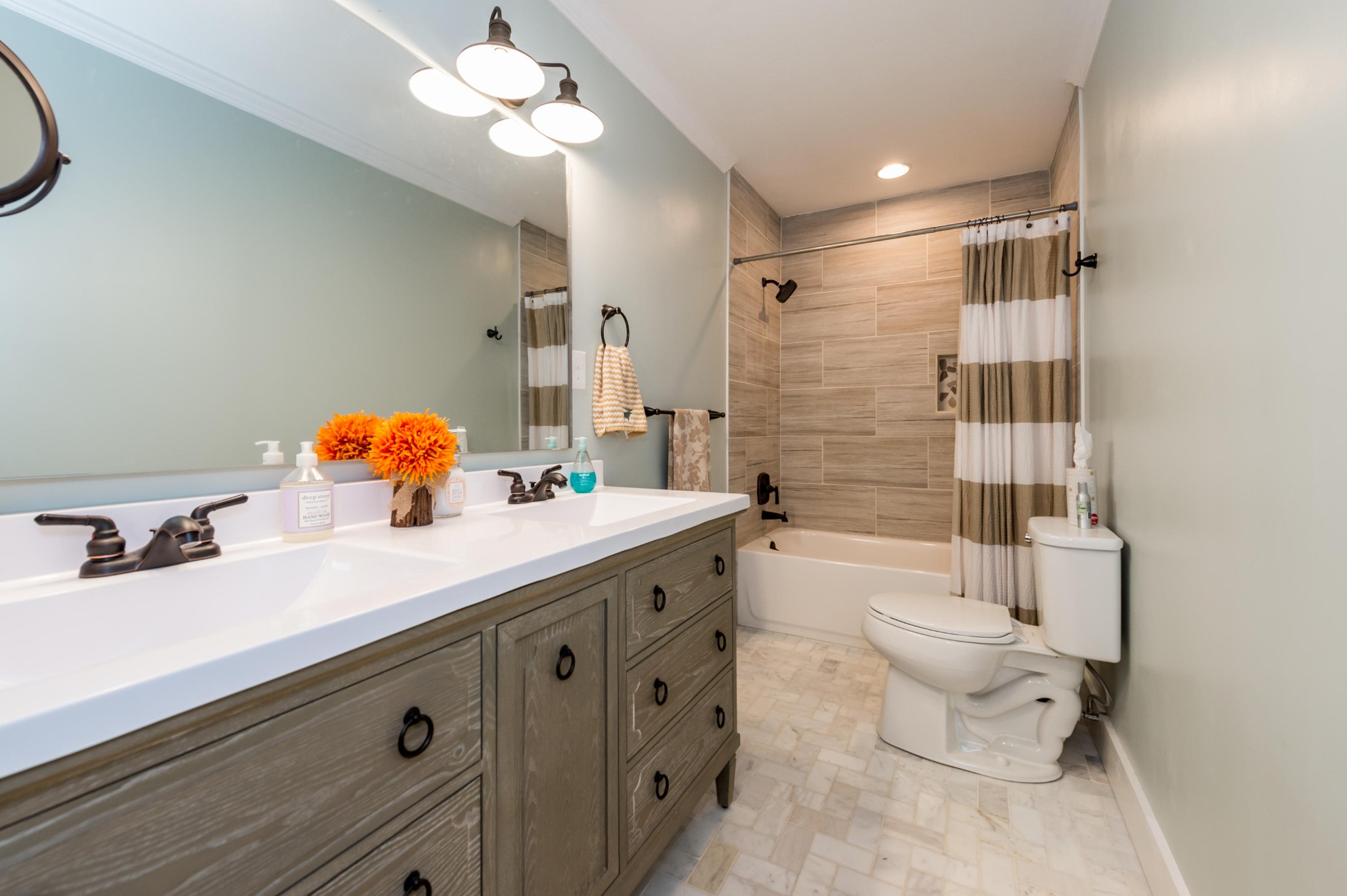2324 Branch Road Loudon, TN 37774 - Photo 10 of 27 a bathroom with a double vanity sink toilet and shower