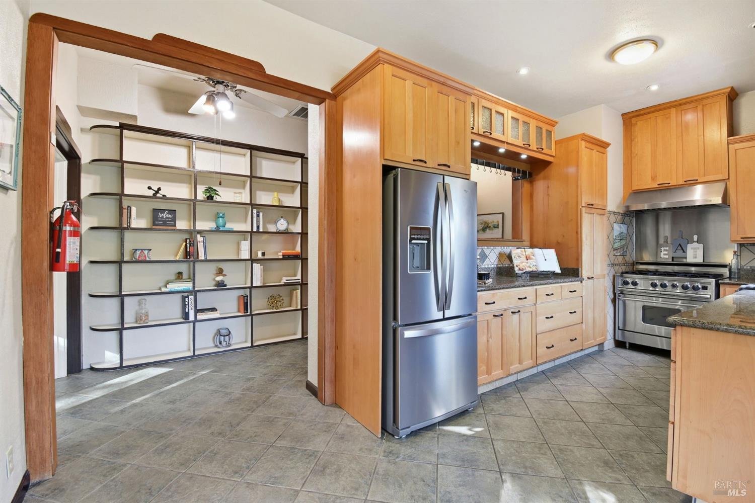 6825 Enterprise Road Glen Ellen, CA 95442 - Photo 13 of 51 a kitchen with stainless steel appliances granite countertop a refrigerator and a stove top oven