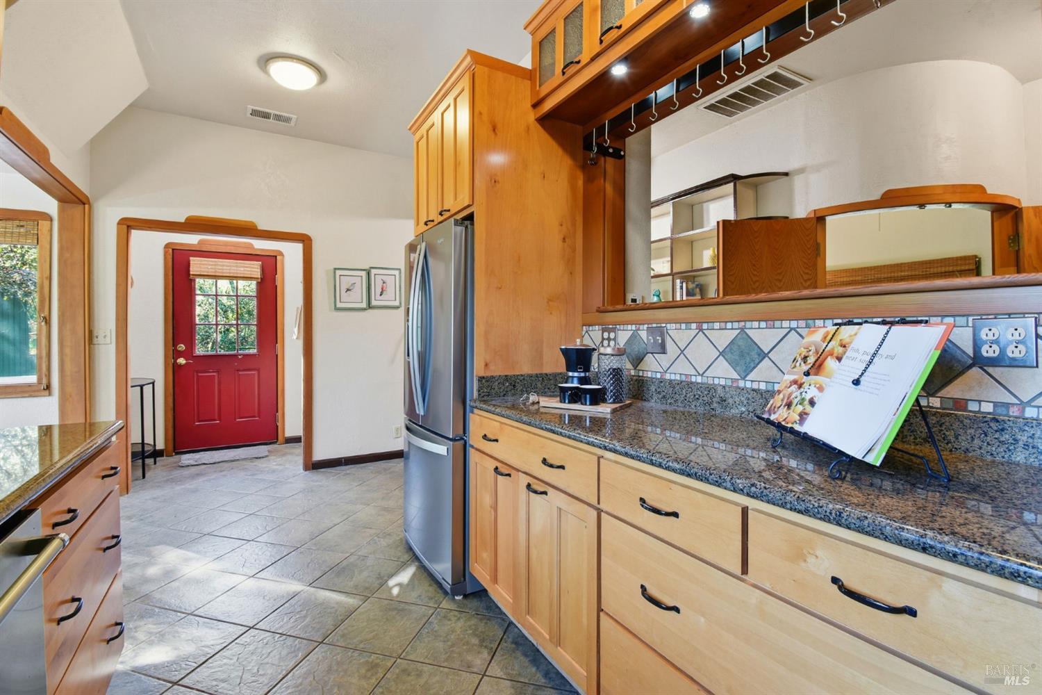 6825 Enterprise Road Glen Ellen, CA 95442 - Photo 14 of 51 a kitchen with granite countertop a sink a stove and cabinets