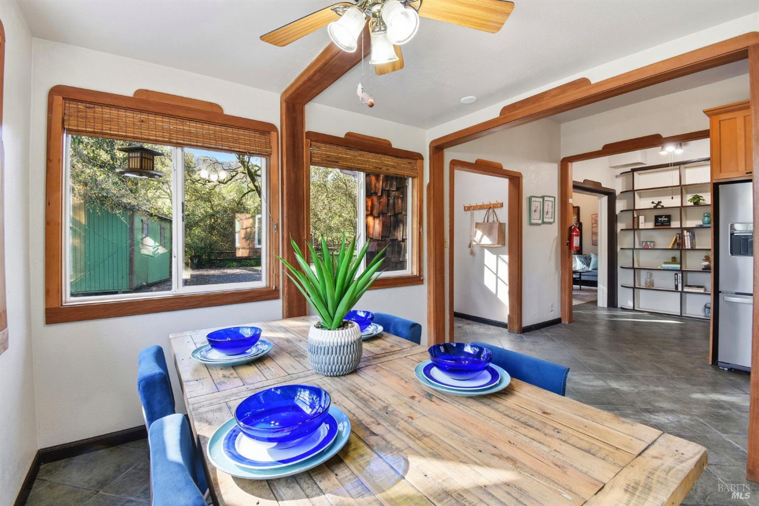 6825 Enterprise Road Glen Ellen, CA 95442 - Photo 16 of 51 a room with lots of potted plants and wooden floor