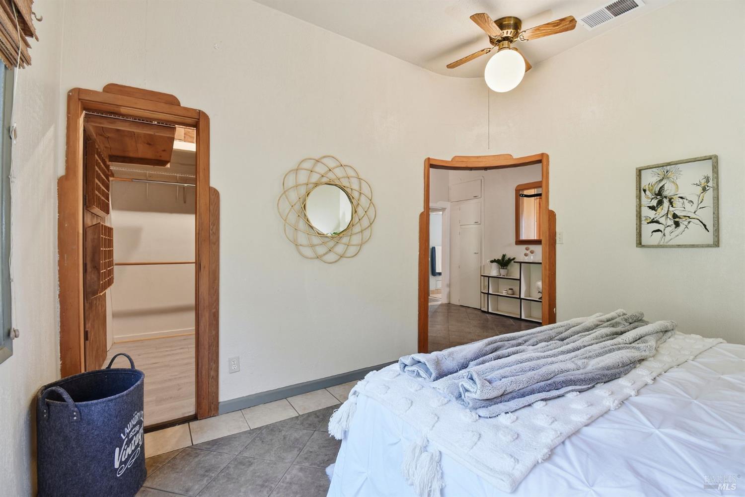 6825 Enterprise Road Glen Ellen, CA 95442 - Photo 26 of 51 a bedroom with a bed and a chandelier