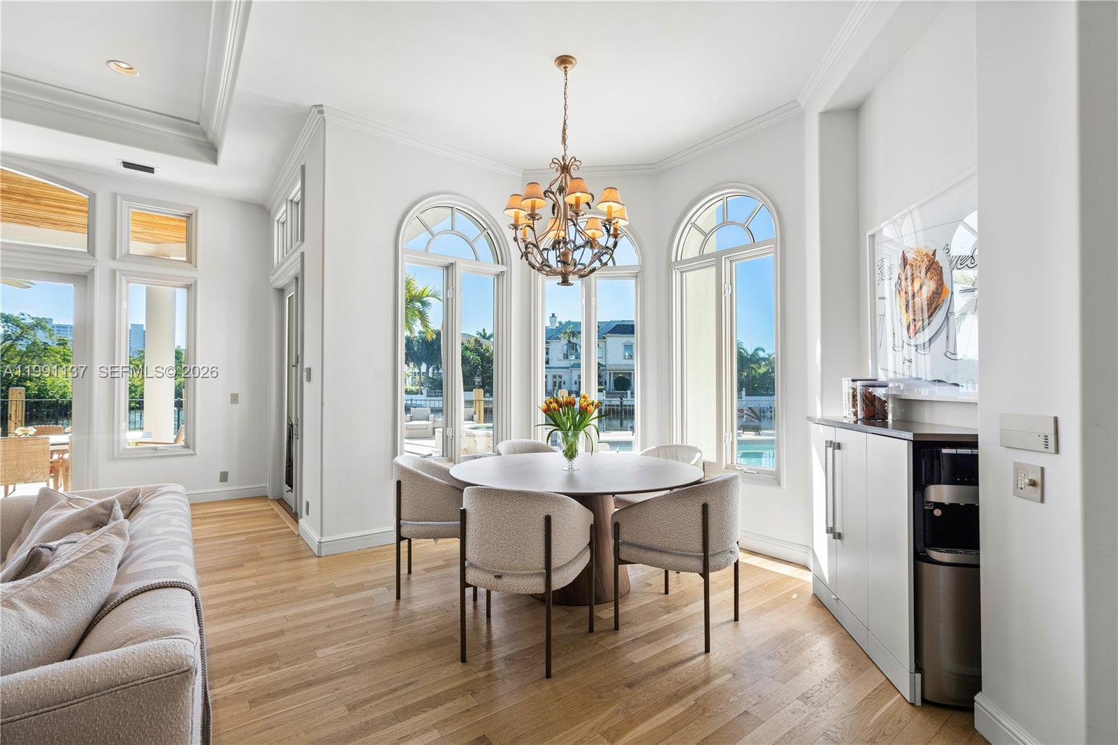 4900 Sanctuary Lane Boca Raton, FL 33431 - Photo 13 of 64 a view of a dining room with furniture window and wooden floor