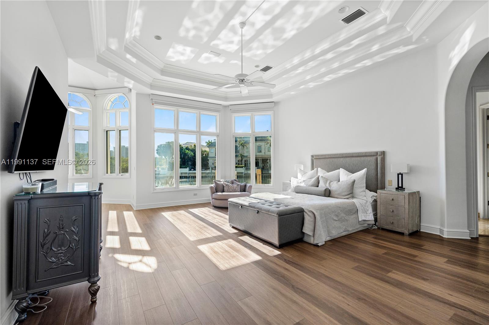 4900 Sanctuary Lane Boca Raton, FL 33431 - Photo 20 of 64 a spacious bedroom with a bed and glass window