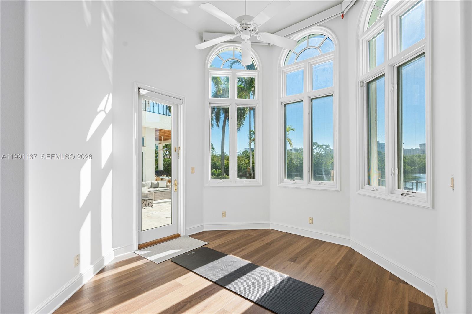 4900 Sanctuary Lane Boca Raton, FL 33431 - Photo 21 of 64 an empty room with windows and entrance