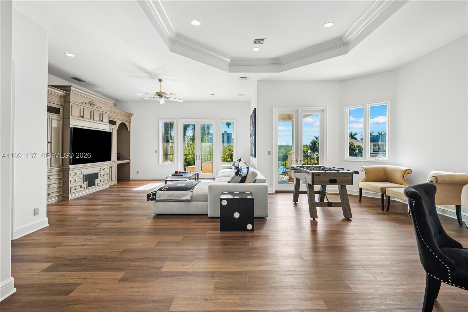 4900 Sanctuary Lane Boca Raton, FL 33431 - Photo 28 of 64 a living room with furniture and a flat screen tv