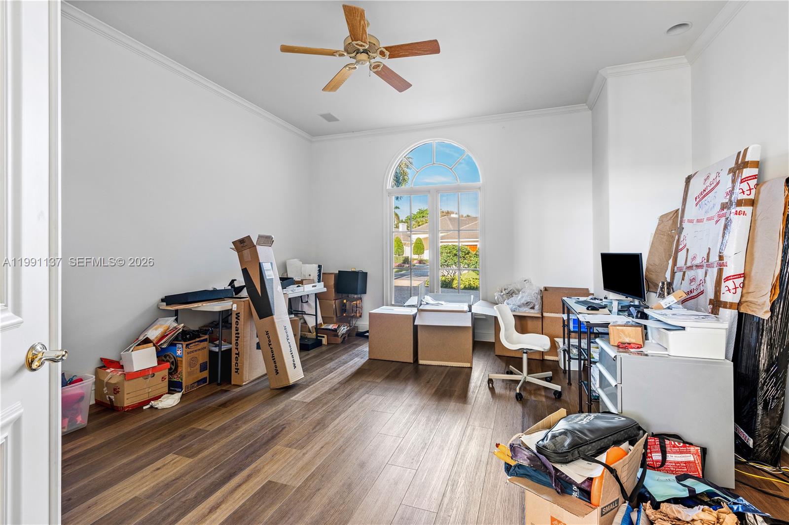 4900 Sanctuary Lane Boca Raton, FL 33431 - Photo 29 of 64 a view of a workspace with furniture and a window