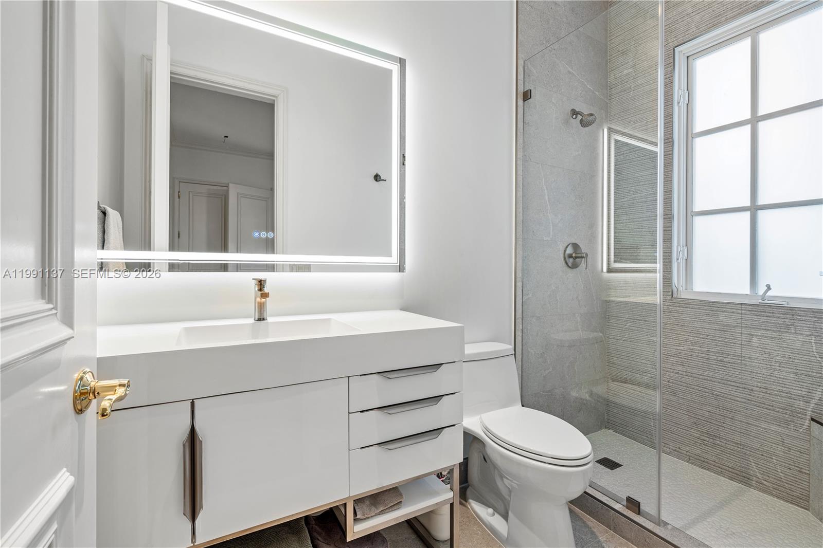 4900 Sanctuary Lane Boca Raton, FL 33431 - Photo 31 of 64 a bathroom with a sink toilet and shower