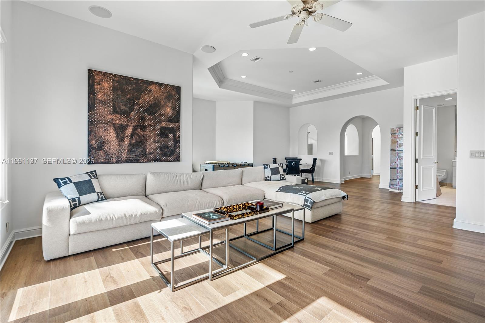 4900 Sanctuary Lane Boca Raton, FL 33431 - Photo 34 of 64 a living room with furniture and a chandelier