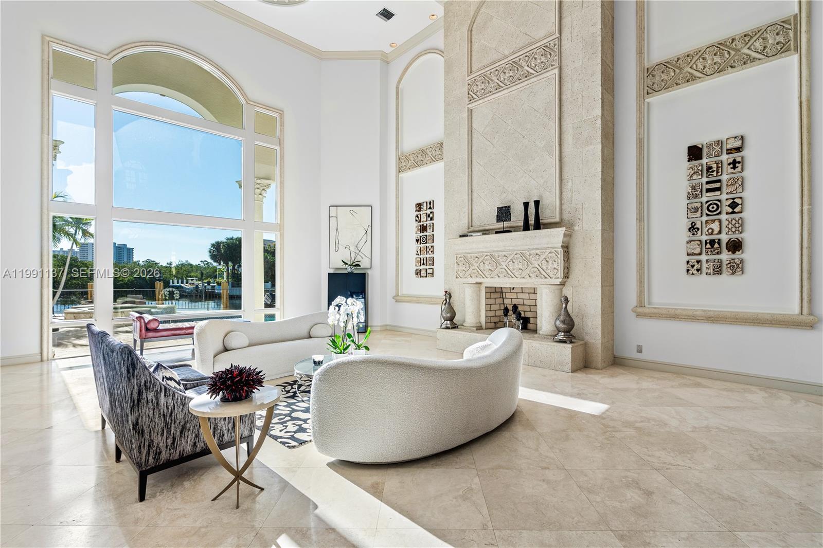 4900 Sanctuary Lane Boca Raton, FL 33431 - Photo 7 of 64 a living room with fireplace furniture and a large window