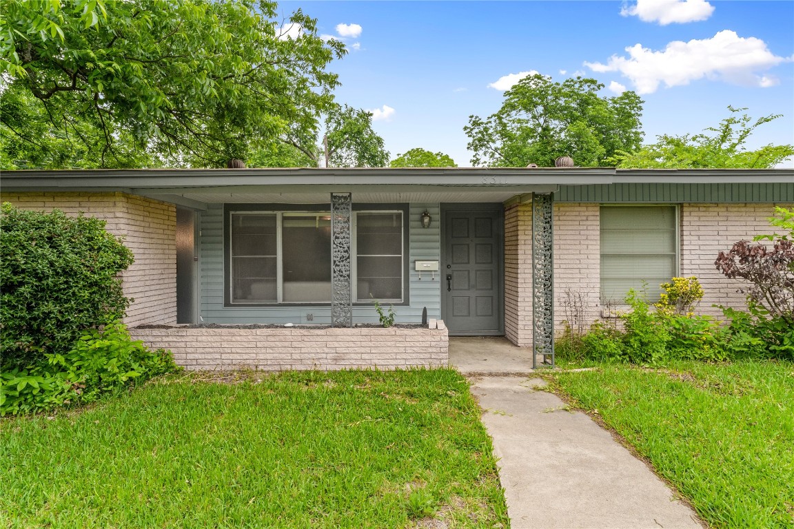 front view of a house with a yard