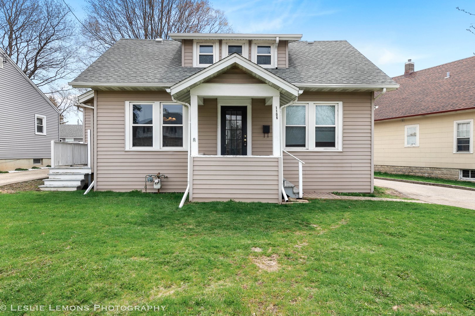 1106 Sycamore Road DeKalb, IL 60115 - Photo 1 of 30 a front view of a house with a yard