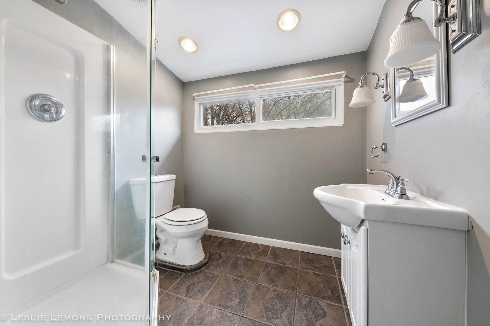 1106 Sycamore Road DeKalb, IL 60115 - Photo 19 of 30 a bathroom with a toilet sink and a mirror