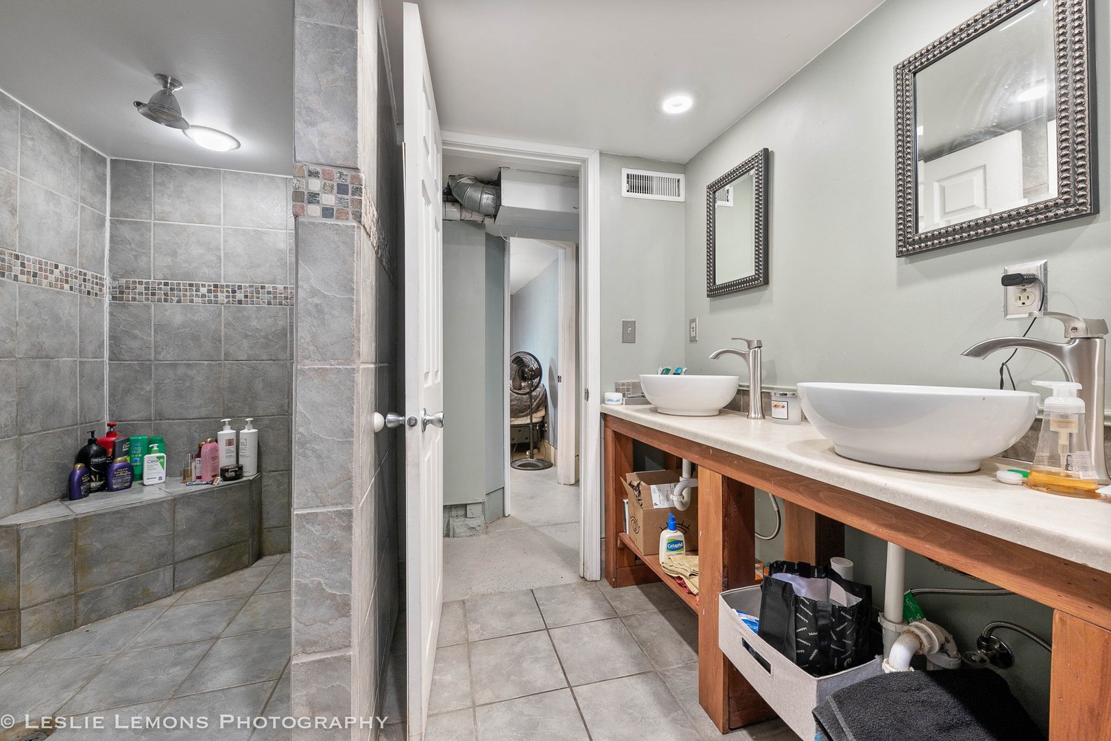1106 Sycamore Road DeKalb, IL 60115 - Photo 27 of 30 a bathroom with a tub sink and mirror