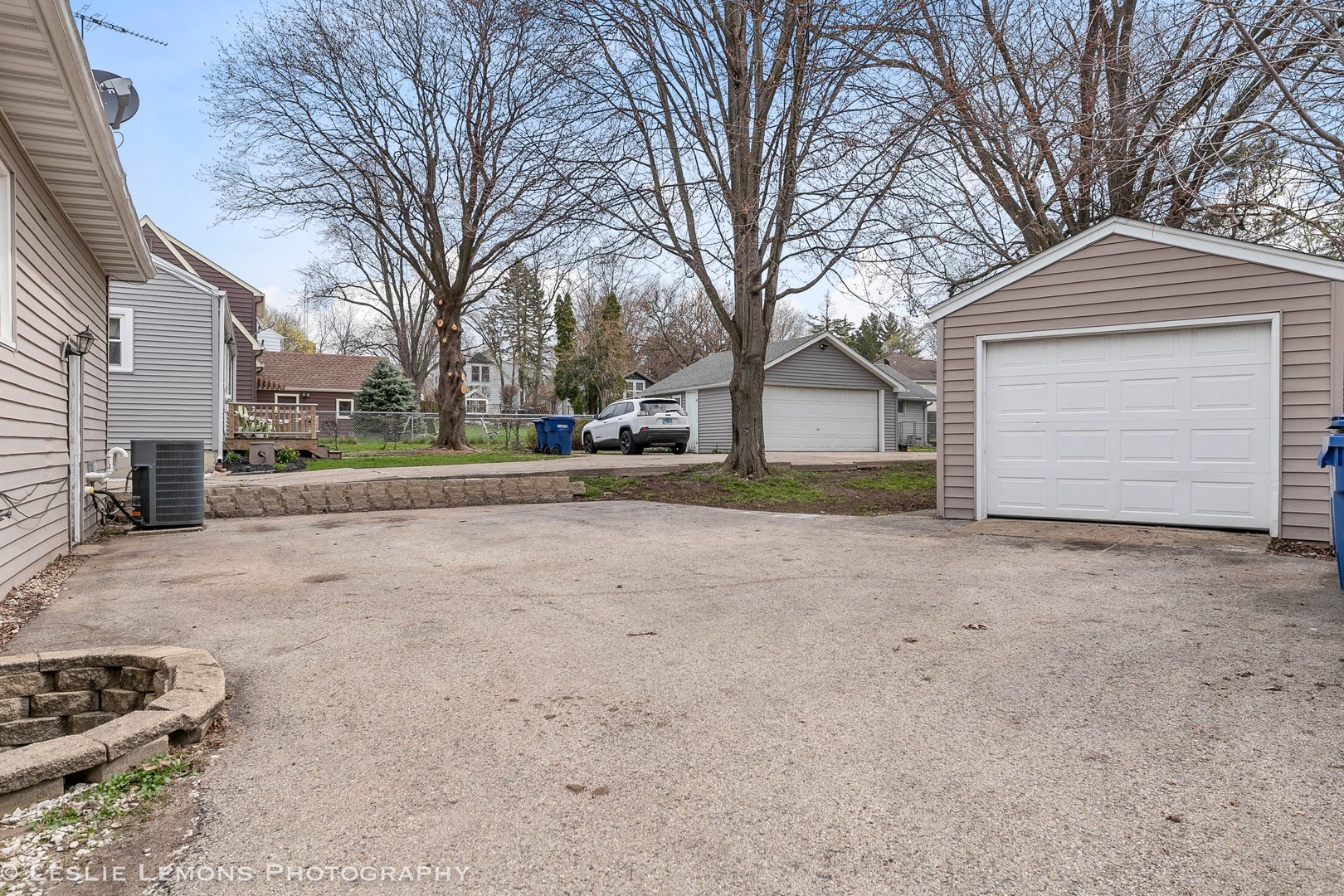 1106 Sycamore Road DeKalb, IL 60115 - Photo 29 of 30 a view of a house with a yard and garage