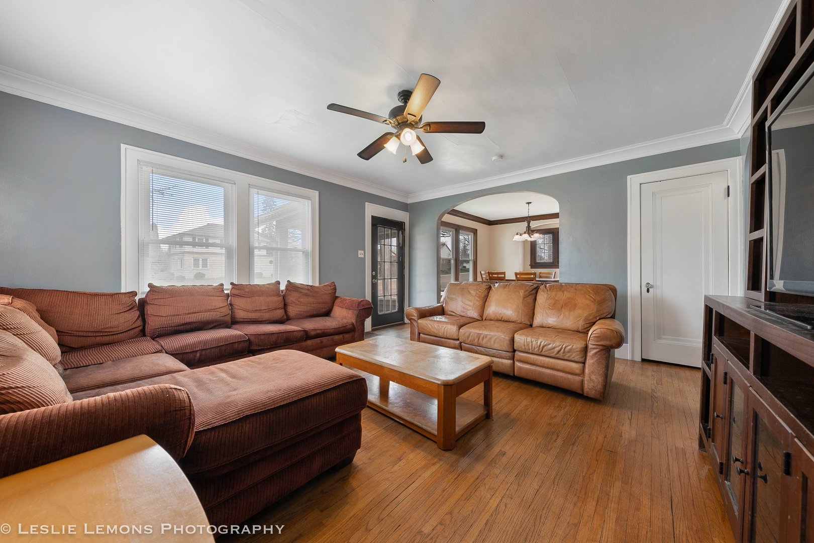 1106 Sycamore Road DeKalb, IL 60115 - Photo 4 of 30 a living room with furniture a ceiling fan a rug and a window