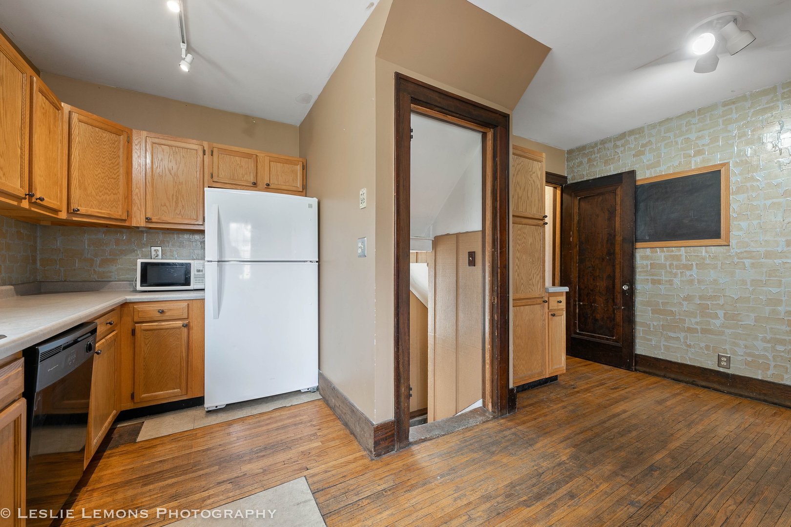 1106 Sycamore Road DeKalb, IL 60115 - Photo 10 of 30 a kitchen with stainless steel appliances granite countertop a refrigerator and a stove