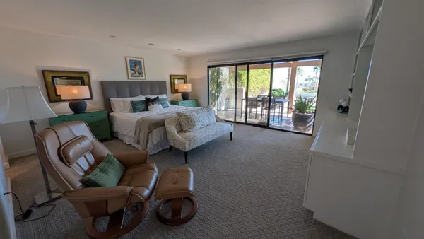 a bed room with a bed and furniture