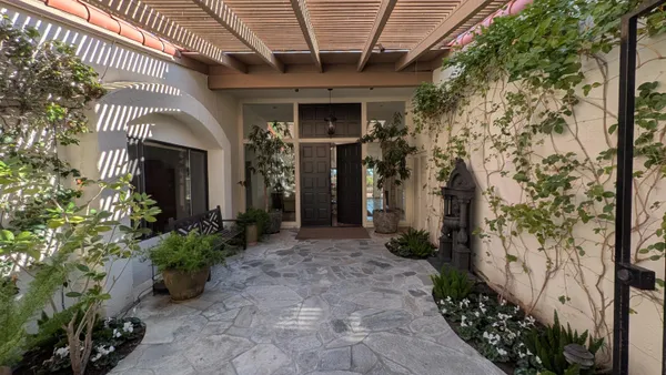 a view of a pathway along the building