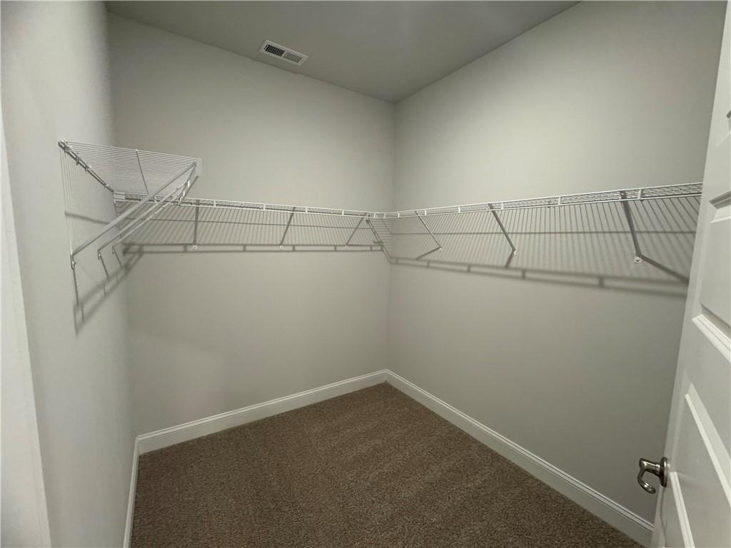 562 Walnut Crk Parkway Pendergrass, GA 30567 - Photo 15 of 20 a view of a room with racks on the wall