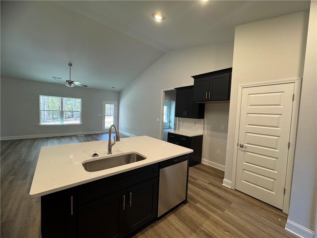 562 Walnut Crk Parkway Pendergrass, GA 30567 - Photo 3 of 20 a kitchen with a sink and a refrigerator