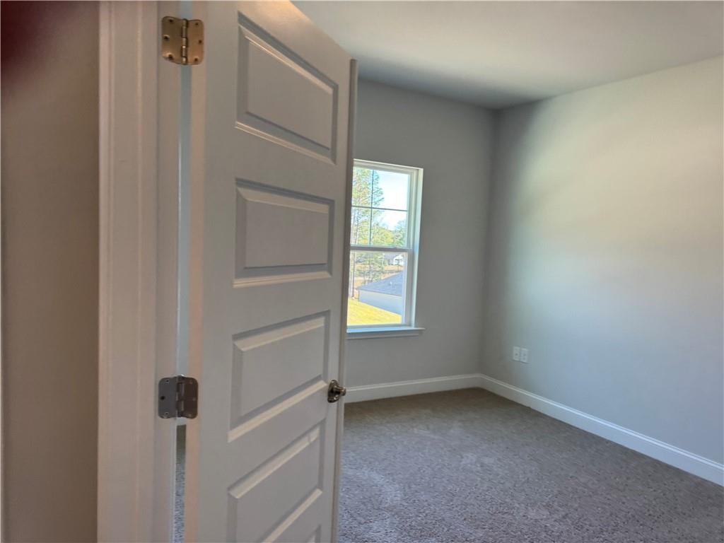562 Walnut Crk Parkway Pendergrass, GA 30567 - Photo 8 of 20 a view of an empty room