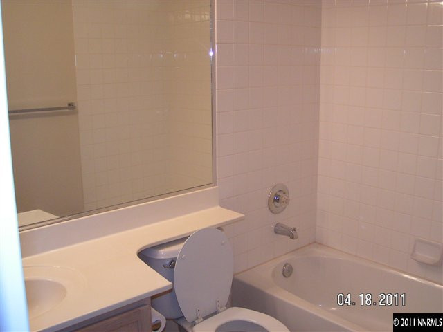 9772 Northrup Drive Reno, NV 89521 - Photo 3 of 6 a bathroom with a bathtub and toilet
