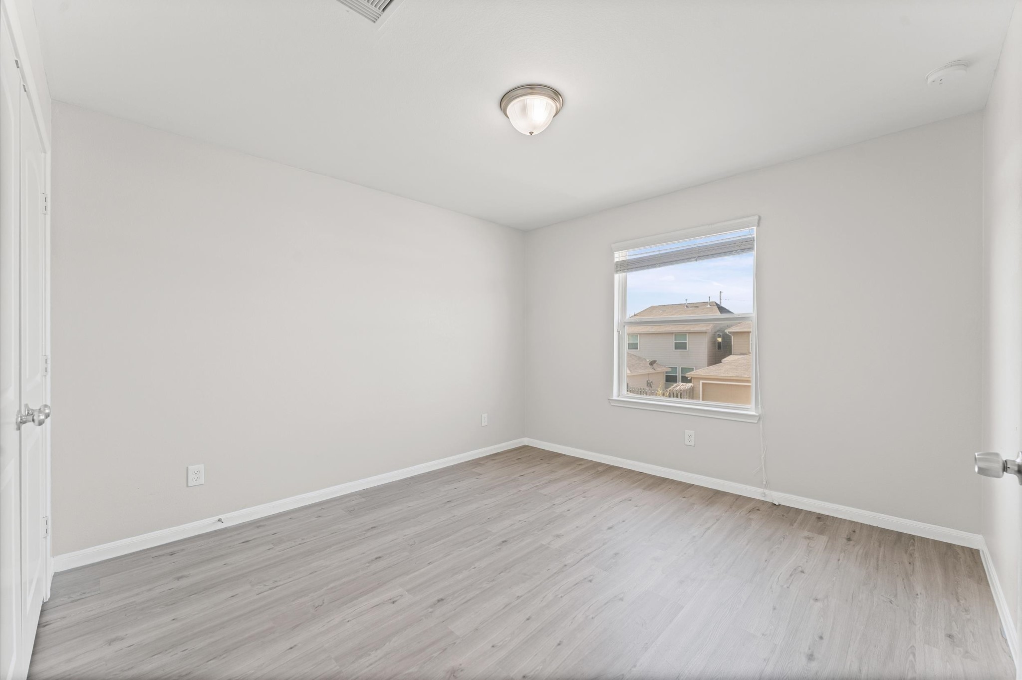 7018 Granite Terrace Lane Houston, TX 77083 - Photo 12 of 18 an empty room with wooden floor and window