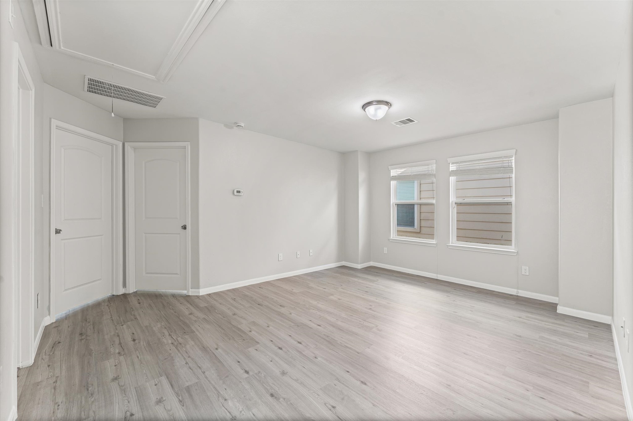 7018 Granite Terrace Lane Houston, TX 77083 - Photo 16 of 18 a view of an empty room with wooden floor and a window