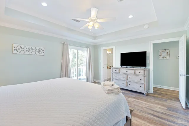 a bedroom with two beds and a chandelier