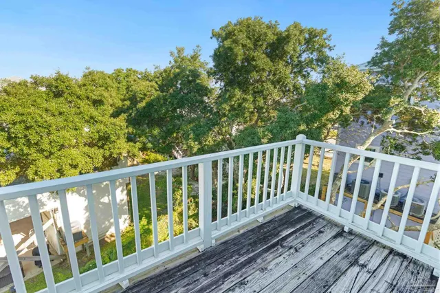 a bedroom with two beds and a flat screen tv