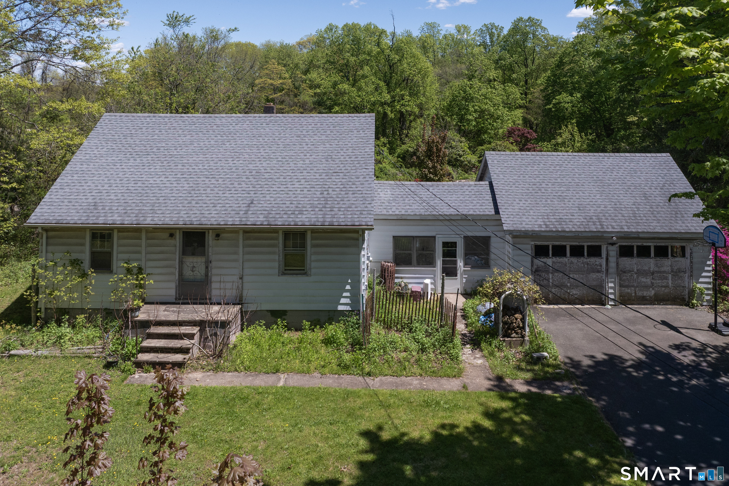 1973 Long Hill Road Guilford, CT 06437 - Photo 6 of 19 a aerial view of a house with a yard table and chairs