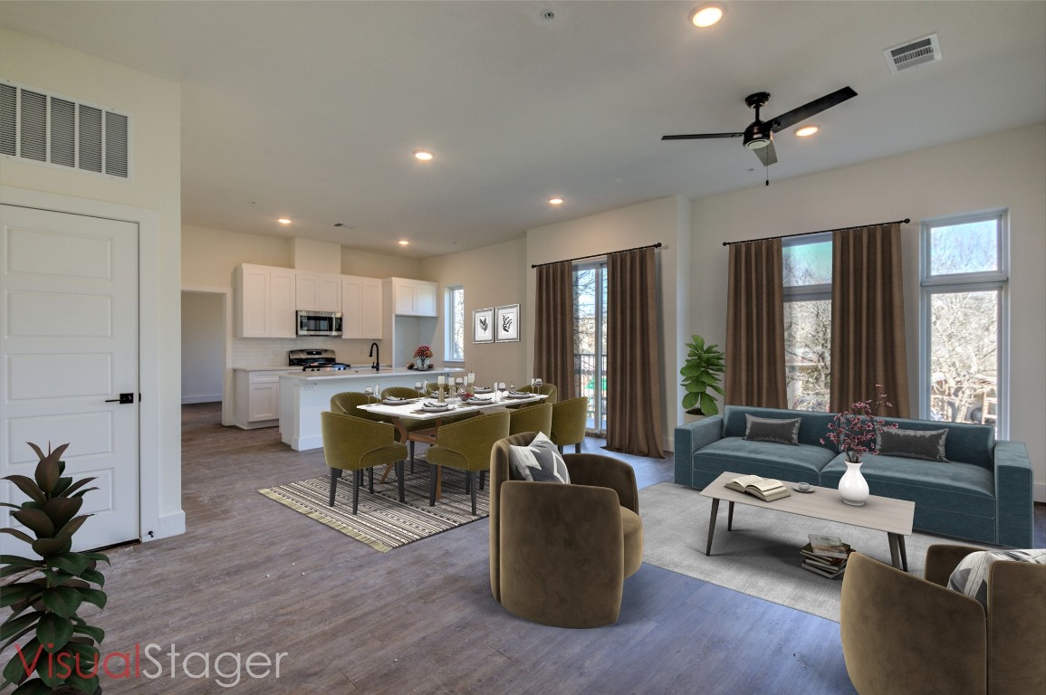 Virtually Staged - Tons of natural light comes through the multiple windows and slider to the private balcony. Luxury vinyl plank flooring throughout the living and bedroom spaces -- no carpet anywhere!