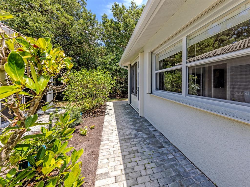 205 Reclinata Circle Venice, FL 34292 - Photo 34 of 62 a view of a pathway with a pathway both side of the house