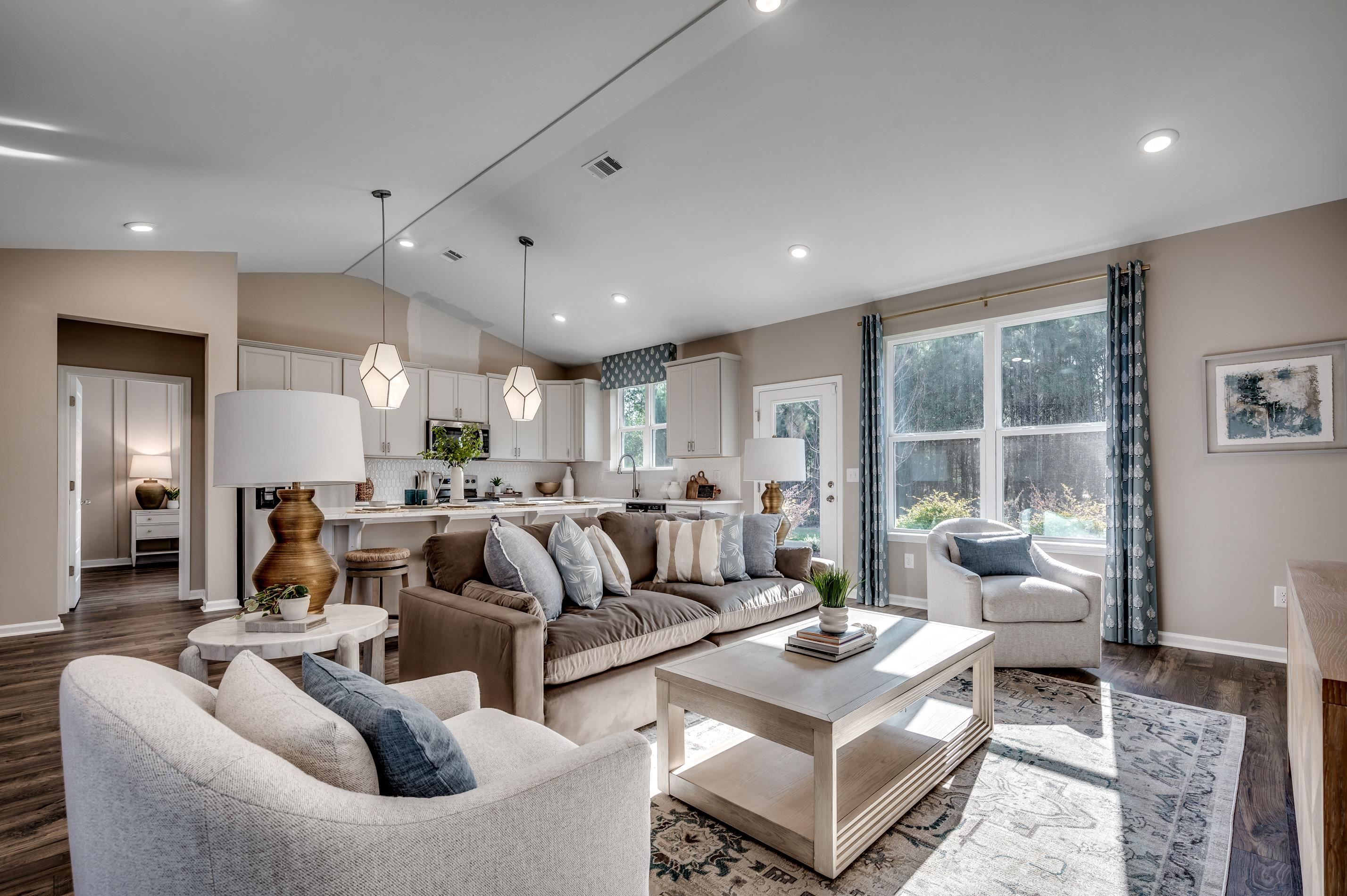 583 Kapalua Loop Little River, SC 29566 - Photo 2 of 15 Living area featuring dark wood finished floors, lofted ceiling, and recessed lighting