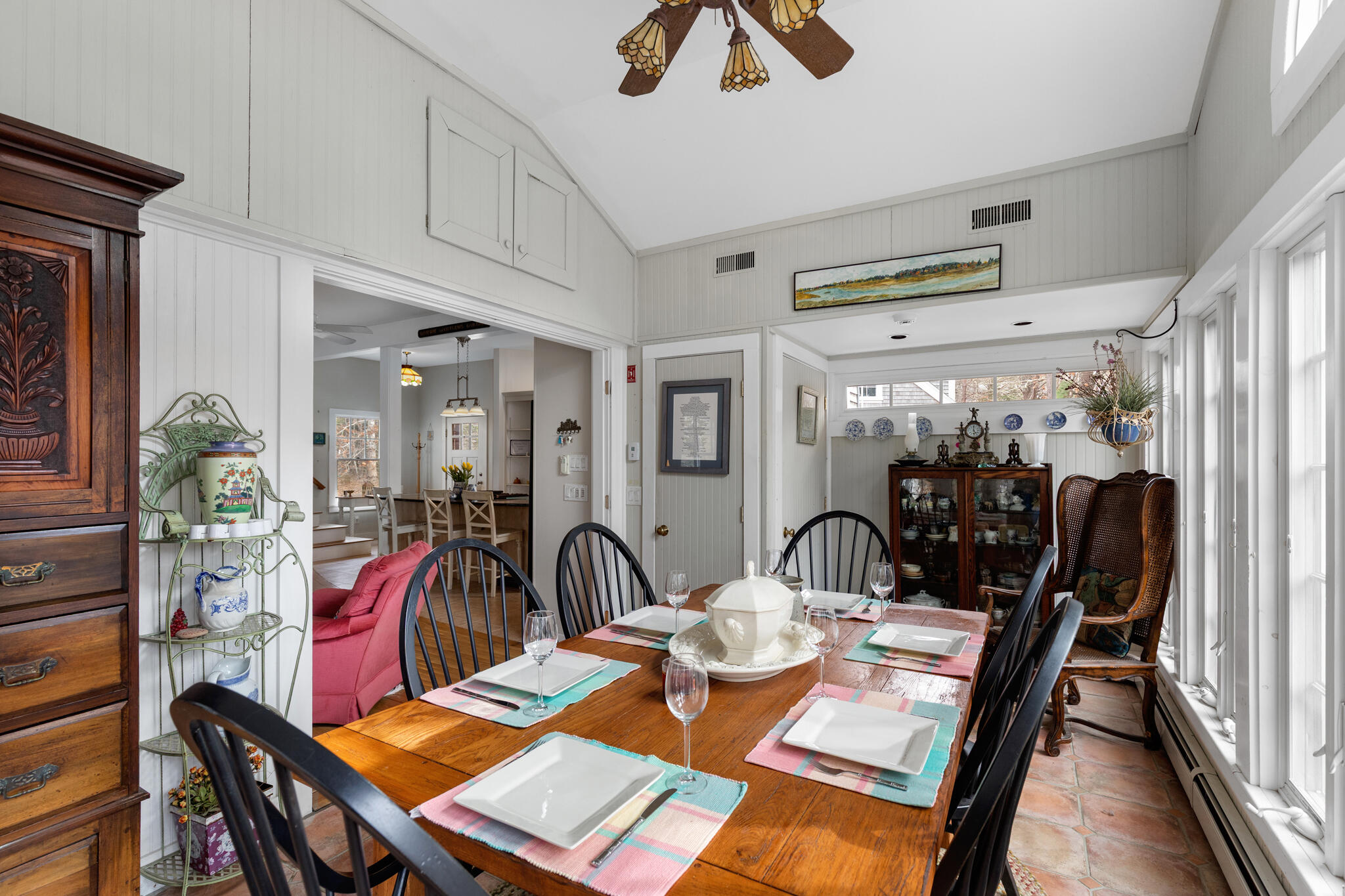 311 South Sunken Meadow Road Eastham, MA 02642 - Photo 22 of 57 a view of a dining room with furniture and a chandelier