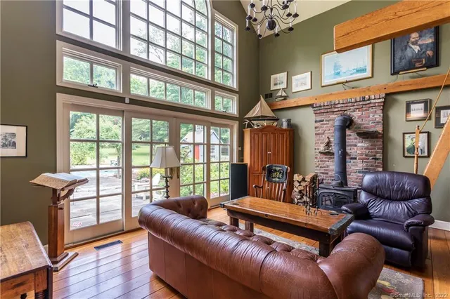 a living room with furniture a ceiling fan and a rug