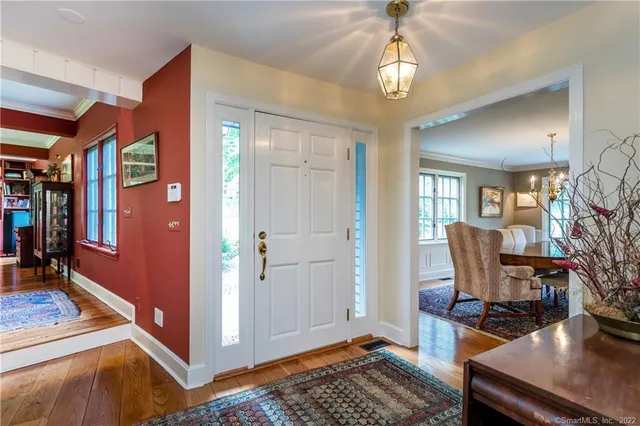 a living room with furniture gym equipment and a large window