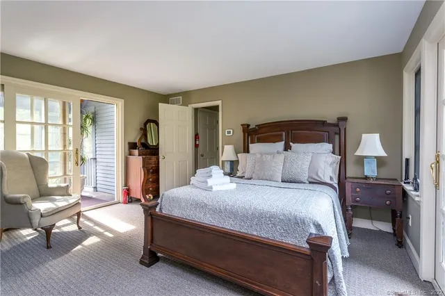 a spacious bathroom with sinks mirror and a bathtub