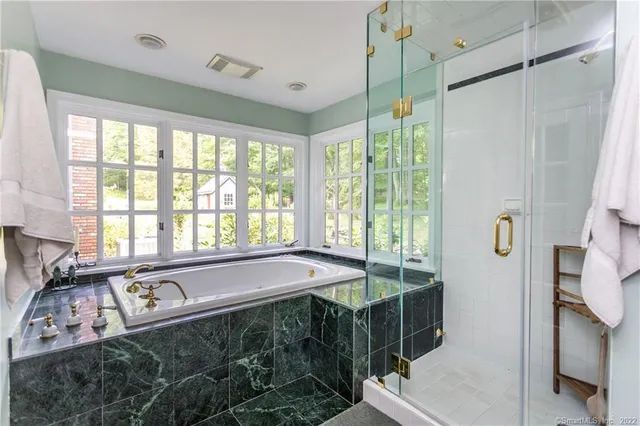 a bedroom with a bed and a night stand