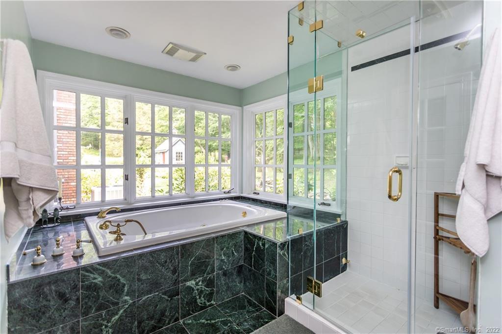 21 Jericho Road North Sherman, CT 06784 - Photo 26 of 40 a bath room with a bed and a sink