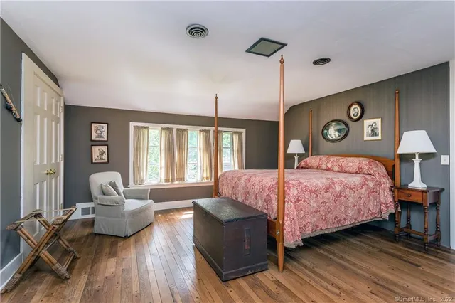 a bathroom with a sink a mirror and a window