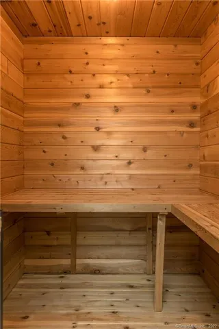 a room with wooden furniture and musical instruments