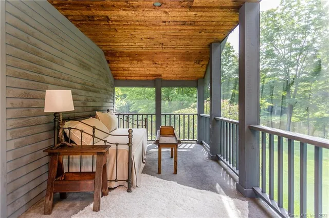 a outdoor space with pool table and chairs