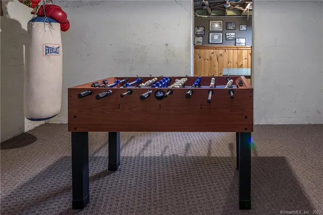 a view of a house with swimming pool and sitting area