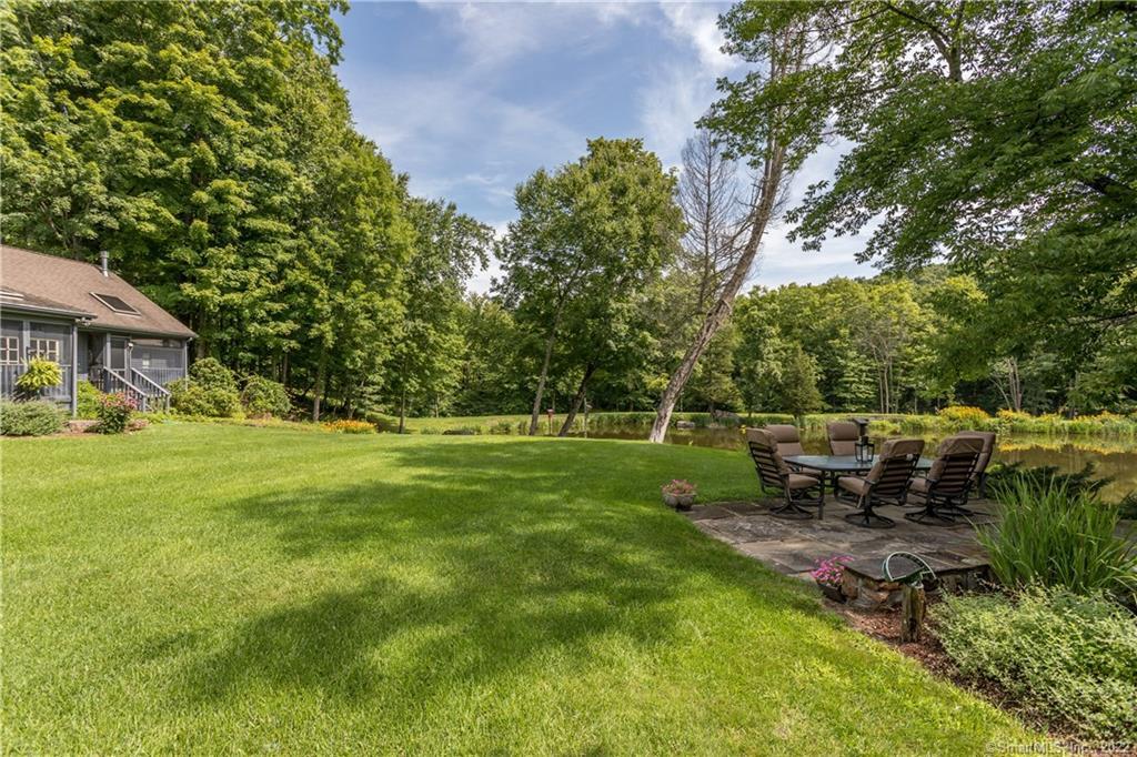 21 Jericho Road North Sherman, CT 06784 - Photo 6 of 40 a view of a house with a backyard