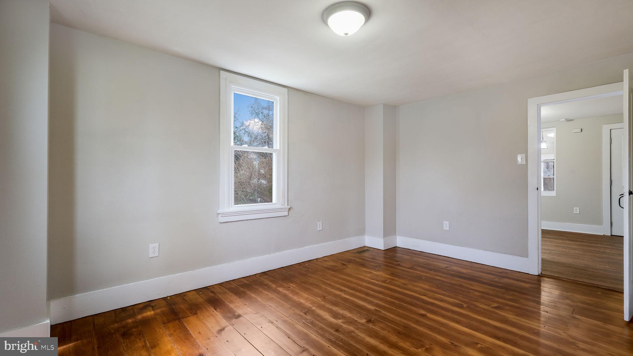 5182 Point Pleasant Pike Doylestown, PA 18902 - Photo 13 of 35 a view of empty room with wooden floor and fan