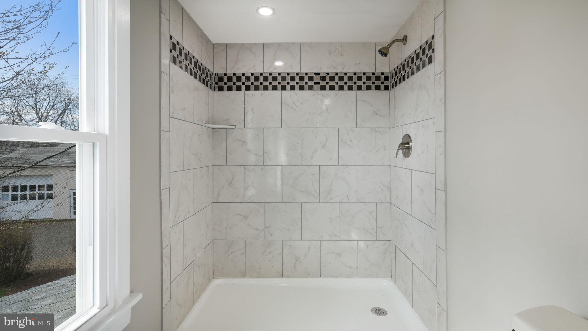 5182 Point Pleasant Pike Doylestown, PA 18902 - Photo 21 of 35 a bathroom with a shower and a bathtub