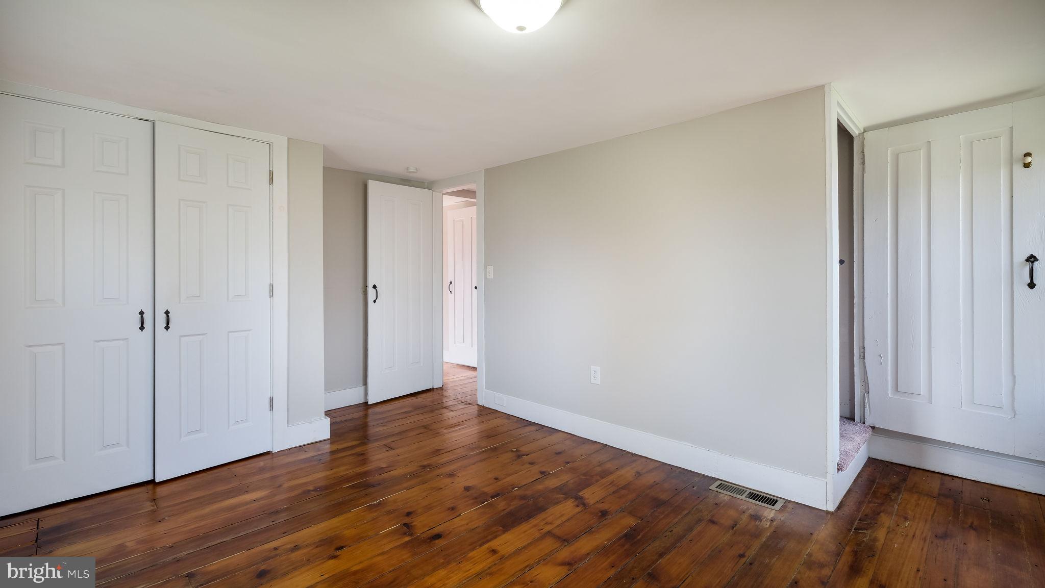 5182 Point Pleasant Pike Doylestown, PA 18902 - Photo 23 of 35 a view of an empty room with wooden floor