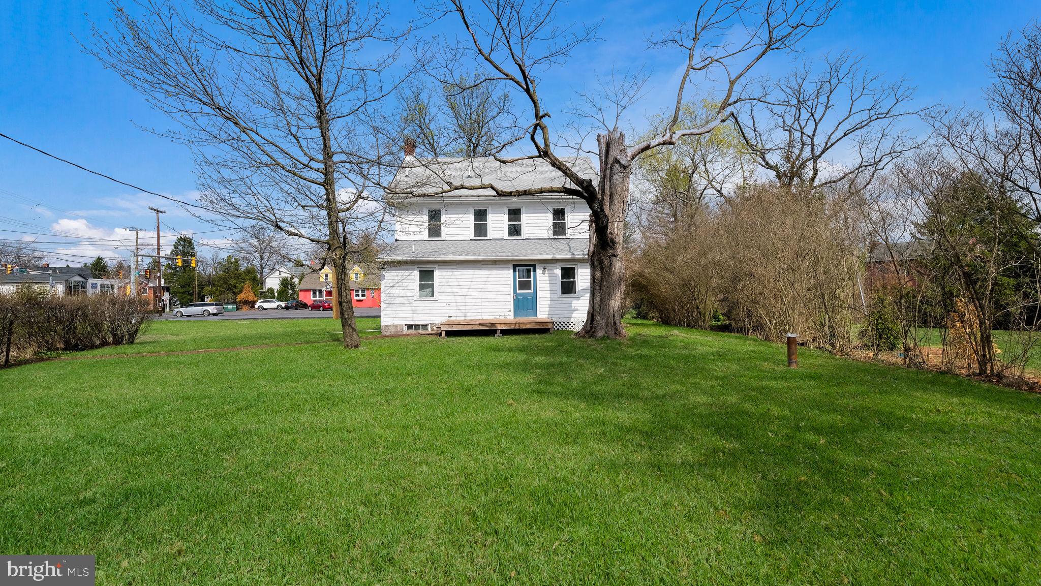 5182 Point Pleasant Pike Doylestown, PA 18902 - Photo 31 of 35 a view of a white house with a big yard and large trees