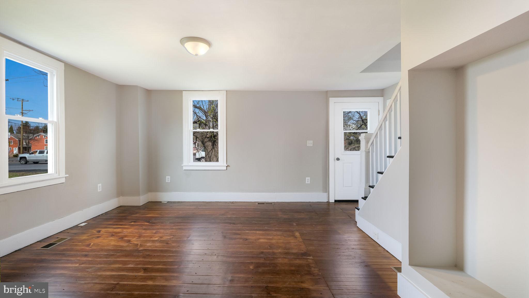 5182 Point Pleasant Pike Doylestown, PA 18902 - Photo 5 of 35 wooden floor in an empty room with a window